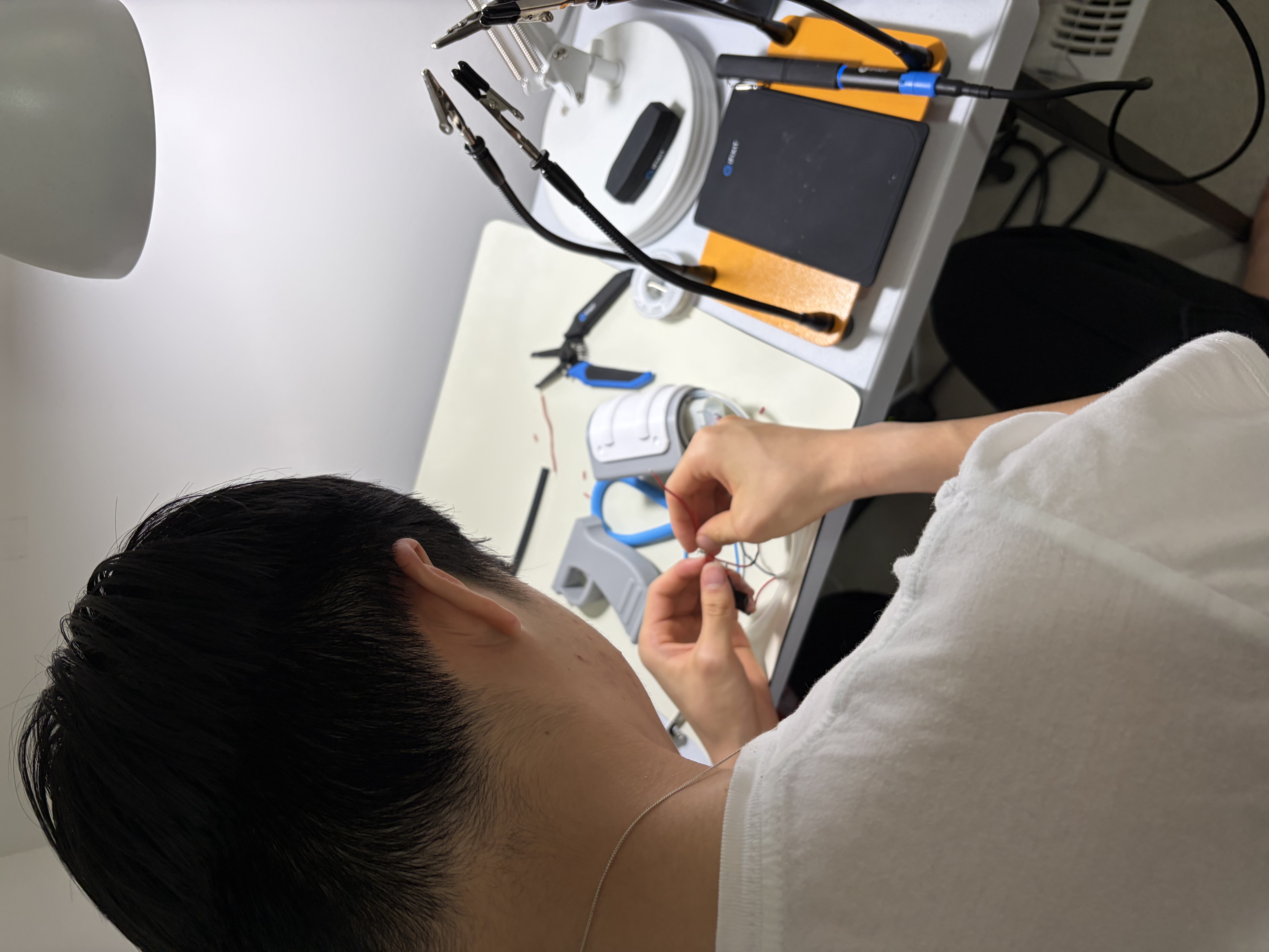 Ethan Yeung assembling assistive technology